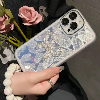 For iPhone 16 Pro Case Electroplating Feather Pattern TPU Phone Cover with Beaded Strap - Sparkling Bow