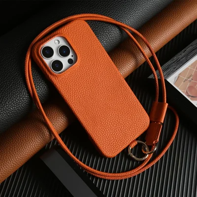 For iPhone 13 Pro Max-hoesje met lanyard van echt koeienleer PC-telefoonhoesje - Oranje