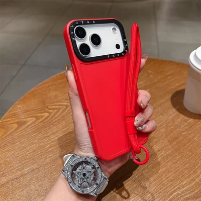 For iPhone 18 Pro Max / 17 Pro Max Case Black Lens Frame Shockproof TPU PC Phone Back Cover with Wrist Strap - Red