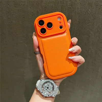 For iPhone 17 Pro Case Round Hole Shockproof PU + TPU Phone Back Cover - Orange