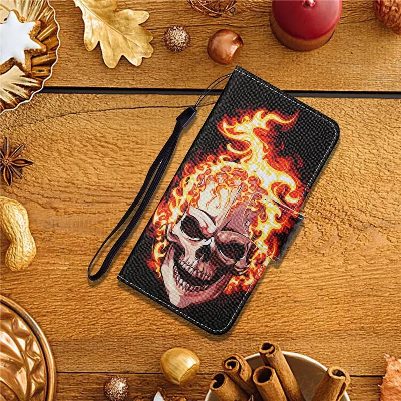 Colorful Pattern Printing PU Leather Phone Stand Case with Strap for Samsung Galaxy A12 - Skull and Fire