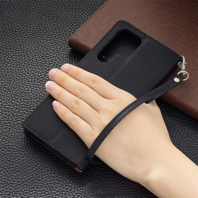 Litchi Texture Solid Color PU Leather Wallet Stand Case Protective Phone Shell with Wrist Strap for Samsung Galaxy S22 Ultra 5G - Black