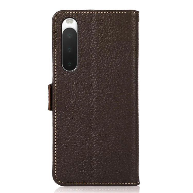 Khazneh Para Sony Xperia 10 IV Litchi Textura Case de Billetera de Cuero Genuino Bloqueo Rfid Bloqueo Doble Magnético Magnética Tapa Anti-caza - Marrón