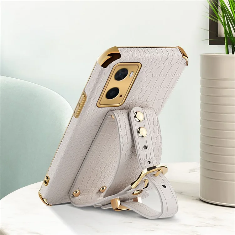 Für Oppo A36/A76 PU Lederbeschichtete TPU -hülle Krokodil Textur Handriemen Kickstand Elektroplating Telefonabdeckung - Weiß