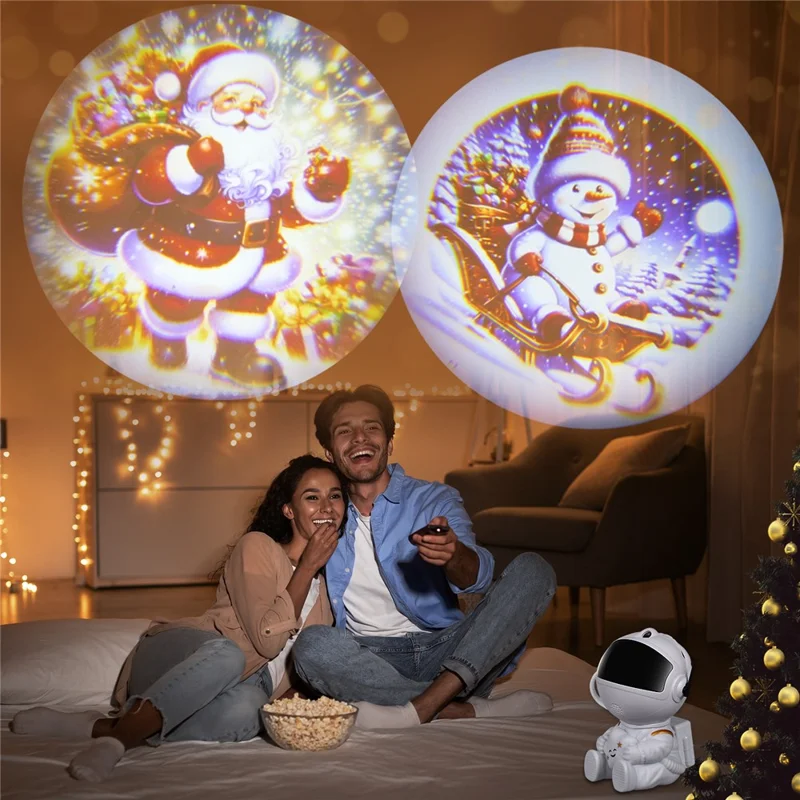 Creative Astronaut Hugging Star Christmas Projector Lamp with 4 Film Discs USB Powered Atmosphere Light Desktop Decor