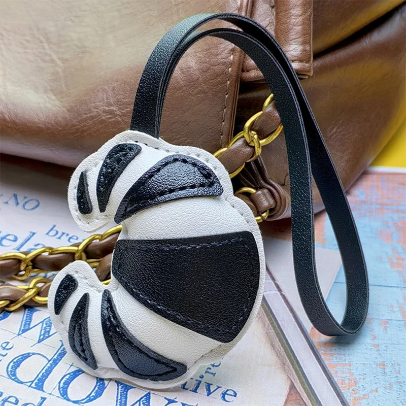 Kreatywny brelok w kształcie croissanta z sztucznej skóry PU, uroczy wisiorek na torbę w kształcie bułki, zawieszka - biały / czarny