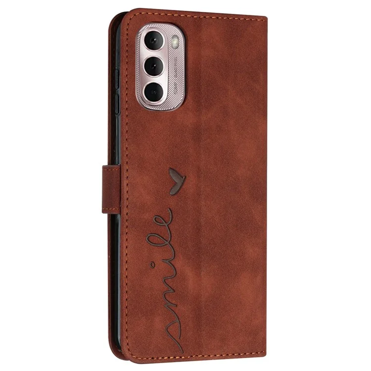 For Motorola Moto G Stylus 4G (2022) Shockproof PU Leather Flip Cover Skin-touch Feeling Heart Shape Imprinted Hands-free Stand Phone Wallet Case with Strap - Brown