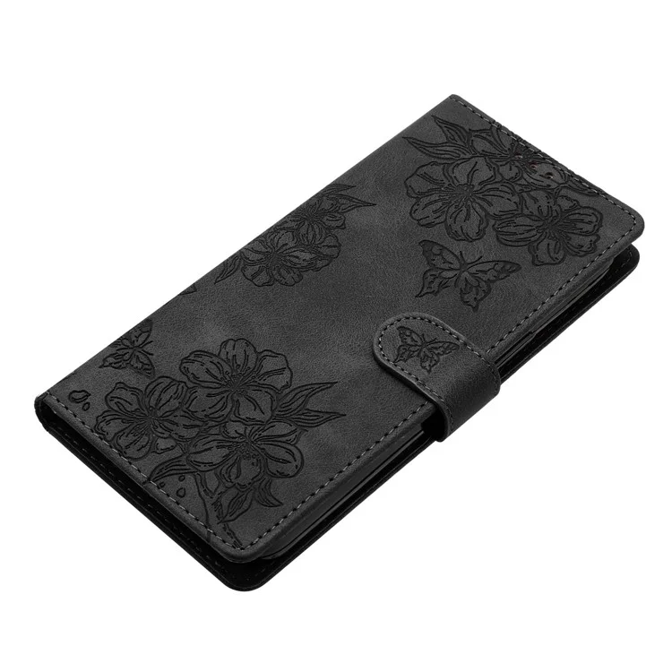Funda de teléfono con efecto piel para iPhone 14 Plus, con diseño de mariposa y flores, cartera - Negro