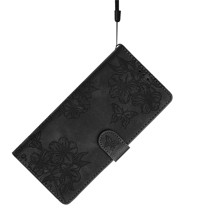 Funda de teléfono con efecto piel para iPhone 14 Plus, con diseño de mariposa y flores, cartera - Negro