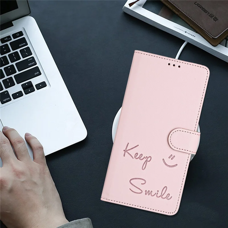 For Samsung Galaxy A16 5G / A16 4G Case Smile Imprinted RFID Blocking Leather Phone Cover with Strap - Pink
