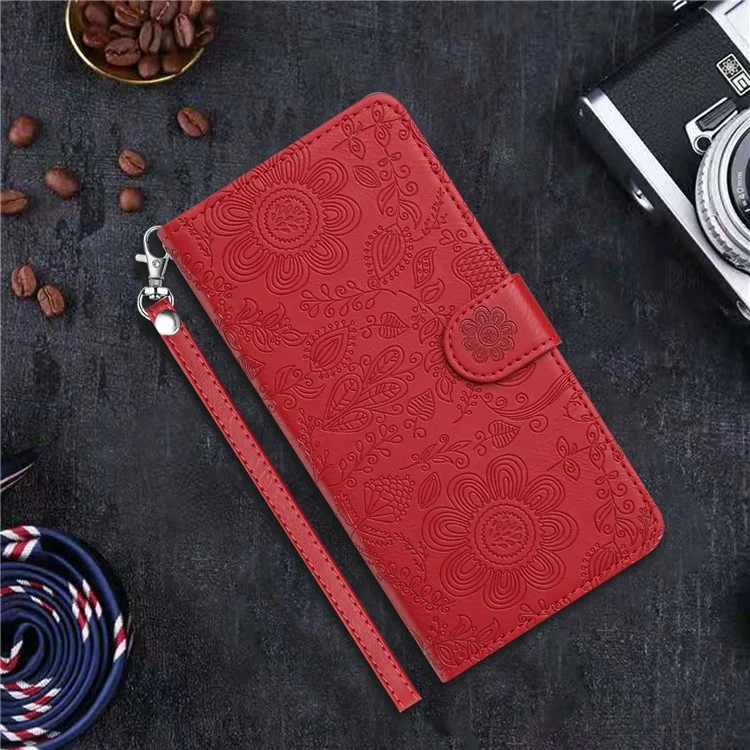 For iPhone 16e Case Flower Imprint Leather Flip Wallet Phone Cover with Wrist Strap - Red