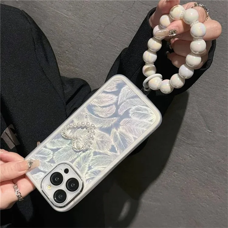 For iPhone 16 Pro Case Electroplating Feather Pattern TPU Phone Cover with Beaded Strap - Double Love