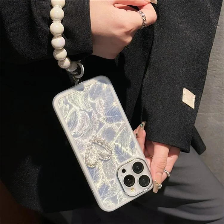 For iPhone 16 Pro Case Electroplating Feather Pattern TPU Phone Cover with Beaded Strap - Double Love