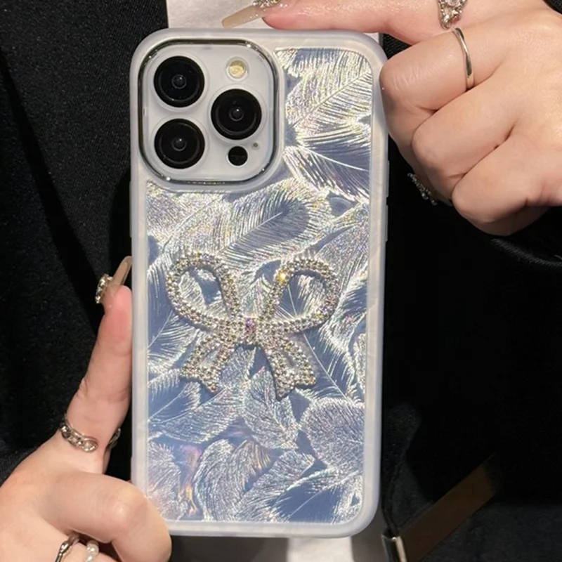 For iPhone 16 Pro Case Electroplating Feather Pattern TPU Phone Cover with Beaded Strap - Sparkling Bow