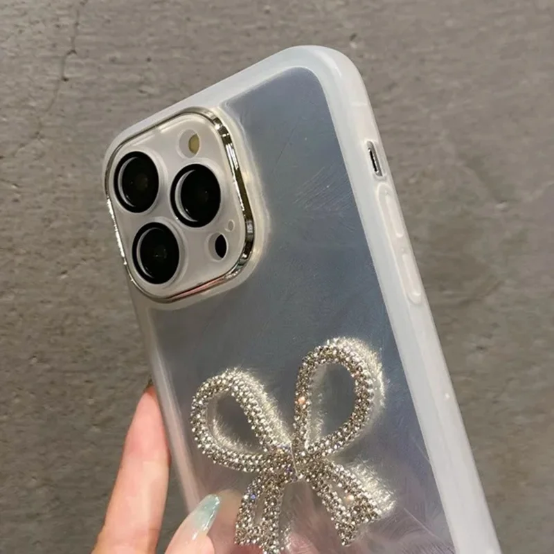 For iPhone 16 Pro Case Electroplating Feather Pattern TPU Phone Cover with Beaded Strap - Sparkling Bow