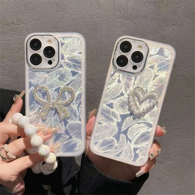 For iPhone 16 Pro Case Electroplating Feather Pattern TPU Phone Cover with Beaded Strap - Sparkling Bow