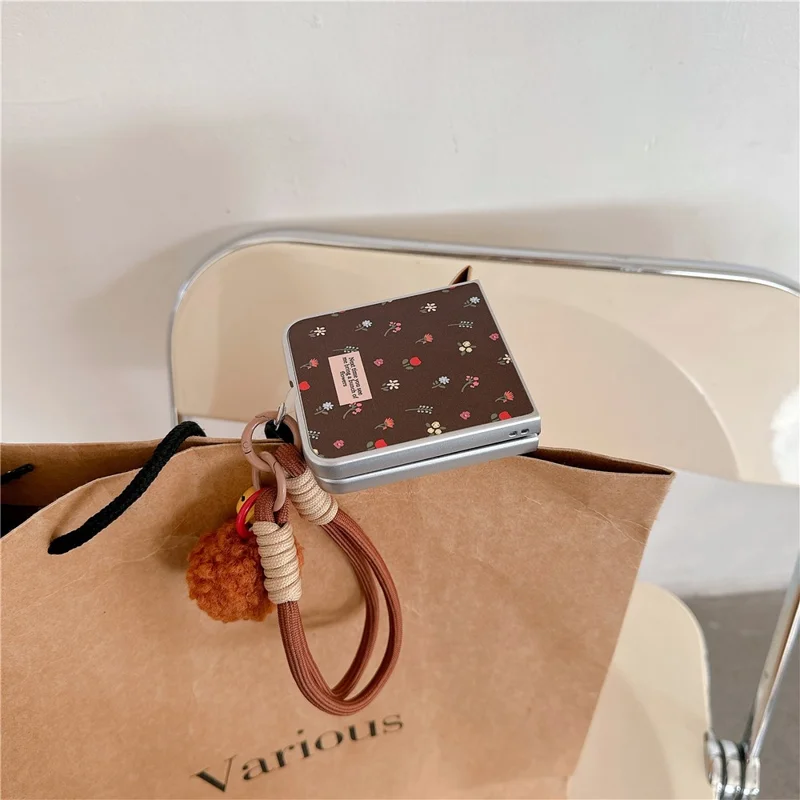 For Samsung Galaxy Z Flip7 FE 5G / Z Flip6 5G Case Leather+PC Floral Phone Cover with Hand Strap - Brown