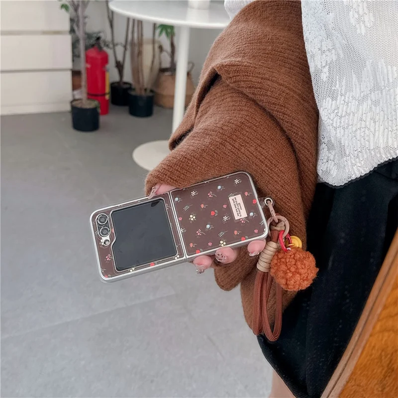 For Samsung Galaxy Z Flip7 FE 5G / Z Flip6 5G Case Leather+PC Floral Phone Cover with Hand Strap - Brown