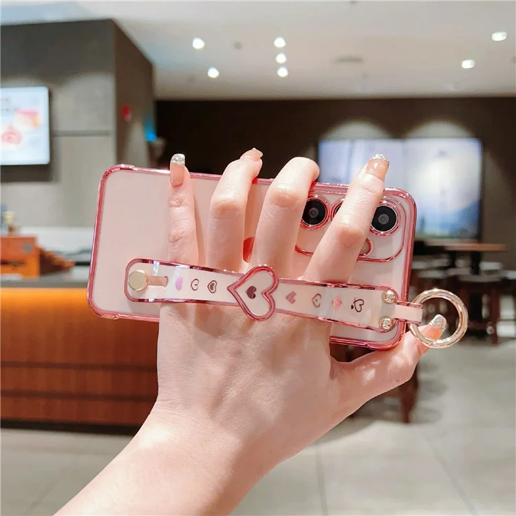 Capa para Samsung Galaxy S25+ com pulseira, suporte e design de coração em TPU - Rosa