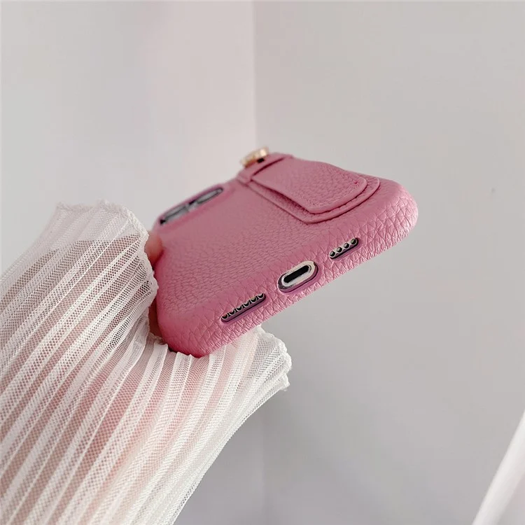 Capa para iPhone 14 Pro Max com suporte para pulso, em couro PU + capa de telefone PET - Rosa