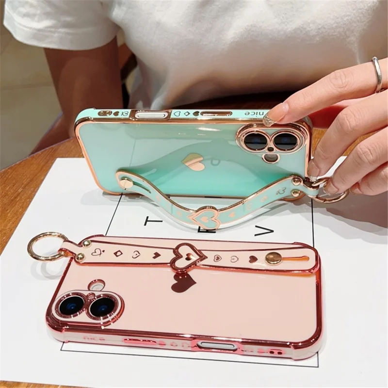 Capa para iPhone 16 Plus com pulseira, suporte, coração de amor, capa de TPU e suporte para dedo - Preto
