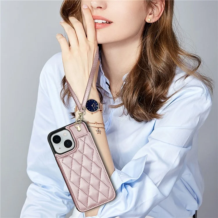 Custodia per iPhone 15 con cinturino da polso, slot per schede, pelle a rombi + copertura in TPU - Rosa oro