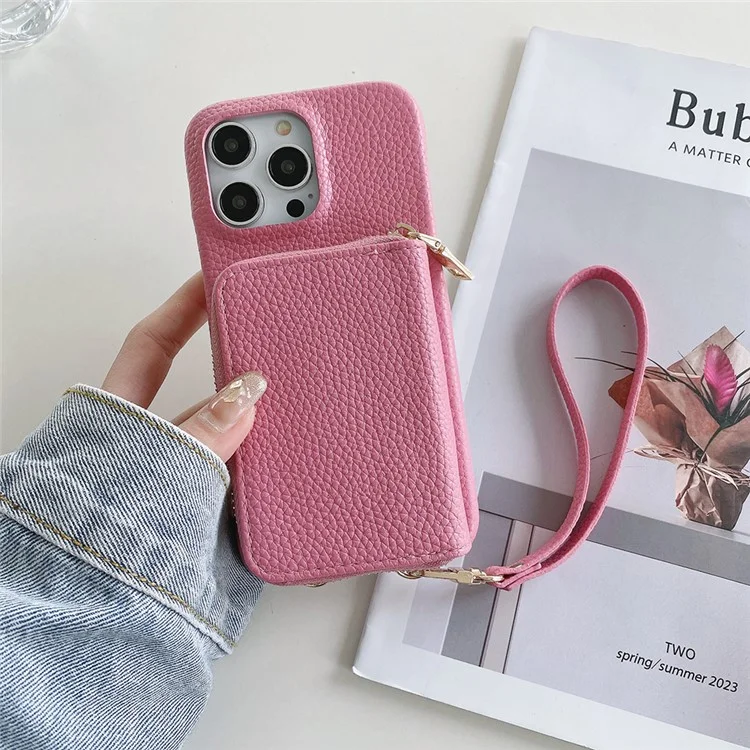 Custodia per iPhone 14 Pro Max con cerniera, slot per schede in pelle PU, cover posteriore del telefono con cinturino da polso - Rosa