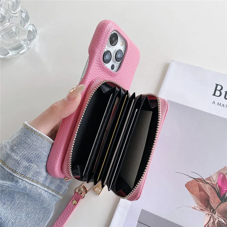 Custodia per iPhone 14 Pro Max con cerniera, slot per schede in pelle PU, cover posteriore del telefono con cinturino da polso - Rosa