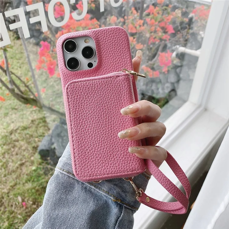 Custodia per iPhone 14 Pro Max con cerniera, slot per schede in pelle PU, cover posteriore del telefono con cinturino da polso - Rosa