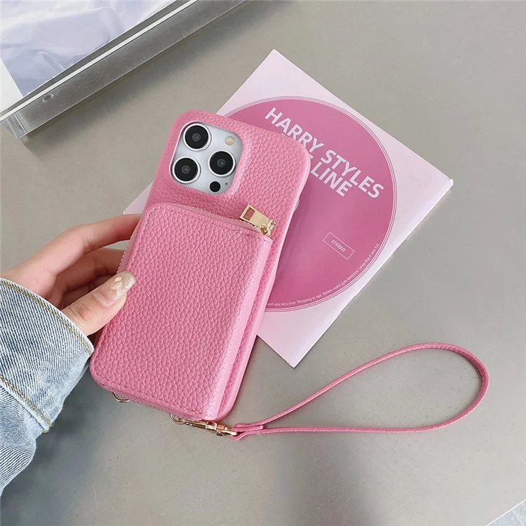 Custodia per iPhone 14 Pro Max con cerniera, slot per schede in pelle PU, cover posteriore del telefono con cinturino da polso - Rosa