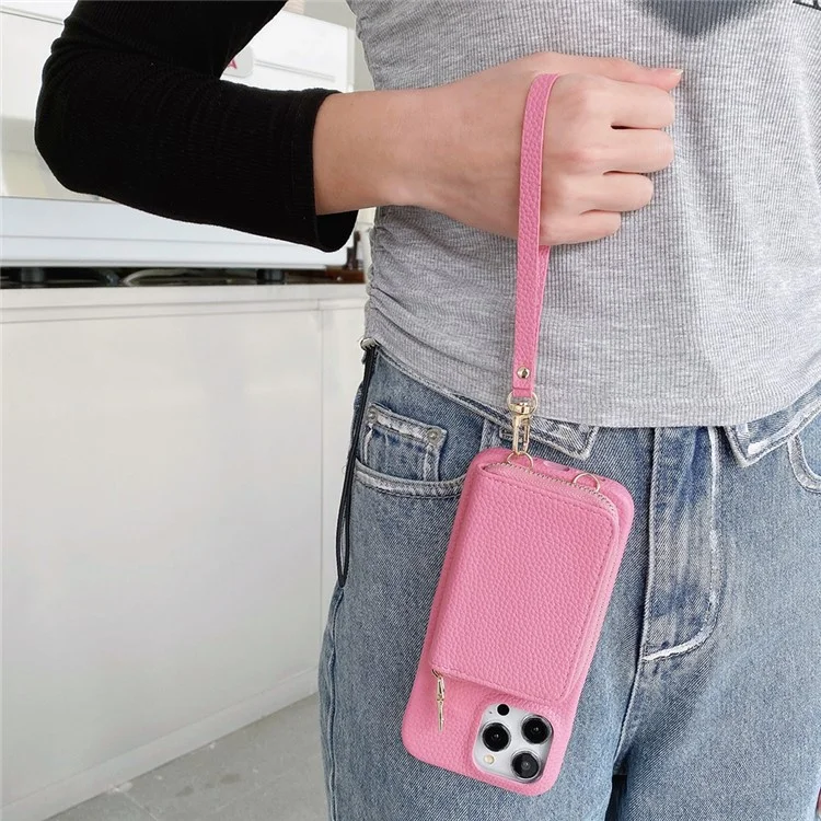 Custodia per iPhone 14 Pro Max con cerniera, slot per schede in pelle PU, cover posteriore del telefono con cinturino da polso - Rosa