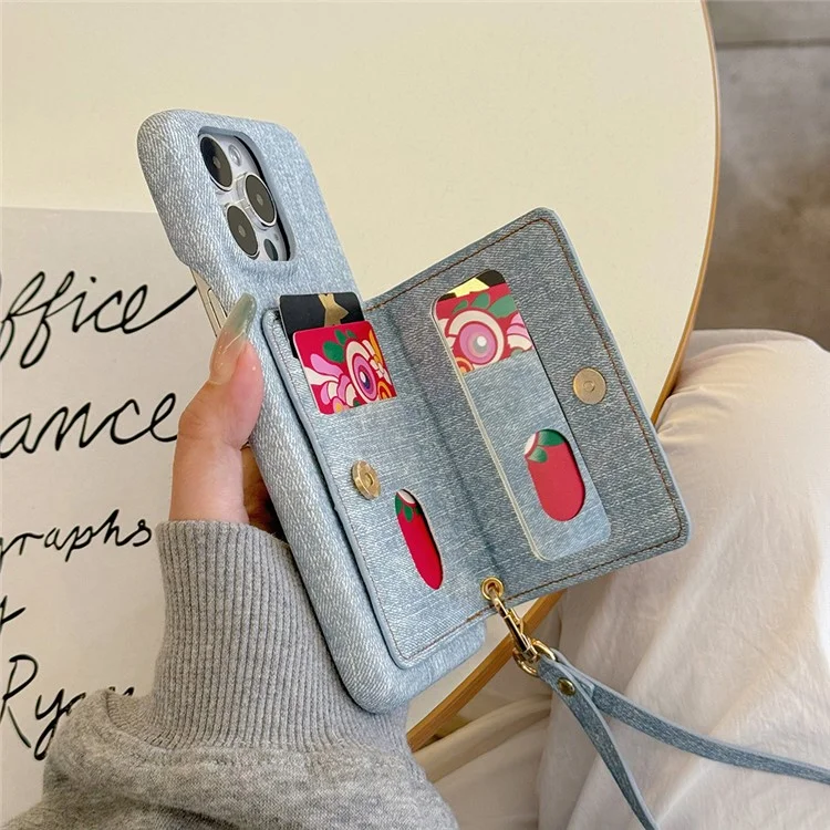 Funda para iPhone 15 Pro Max con bolsillo para tarjetas, soporte y textura de tela vaquera y piel sintética con correa.