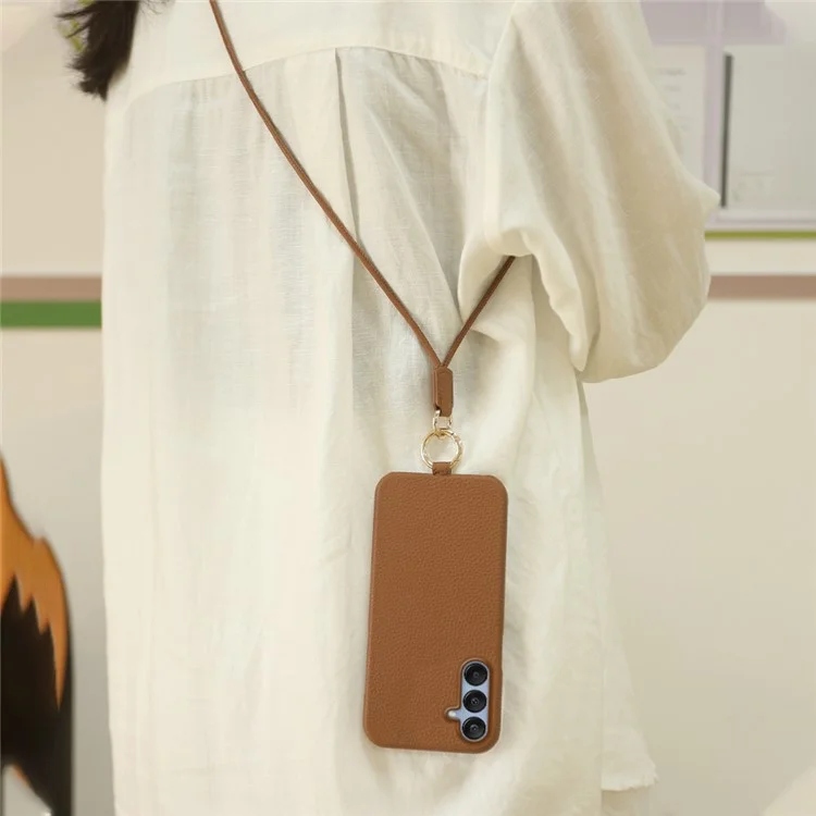 Coque pour Samsung Galaxy S23 FE avec dragonne, en véritable cuir de vache et plastique, coloris orange.