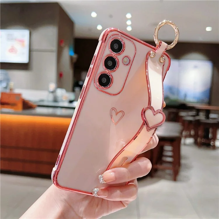 Capa para Samsung Galaxy S24 FE Electroplated Heart Pattern TPU Capa traseira de telefone com pulseira e suporte - Rosa