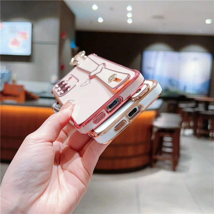 Capa para Samsung Galaxy S25 com padrão de coração eletrodepositado, tampa traseira de TPU com suporte para pulseira e suporte - Rosa