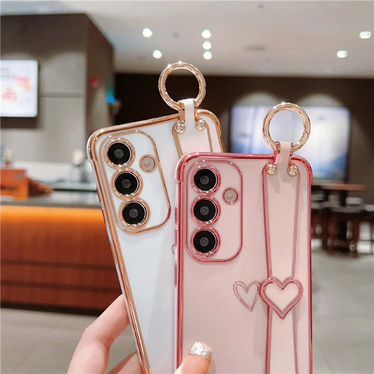 Capa para Samsung Galaxy S25+ Padrão de coração eletroplatinado TPU Capa traseira do telefone com pulseira e suporte - Rosa