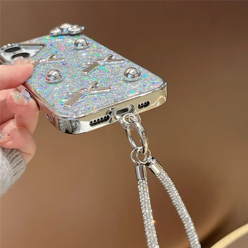 Чехол для iPhone 16 с гибридной защитой и ремешком, с электрофорезным бантиком, серебристо-жемчужным глиттером и эпоксидным дизайном
