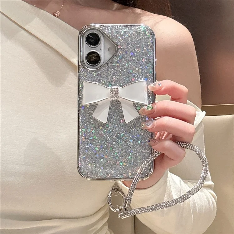 For iPhone 16 Case Large Bowknot Electroplated Glitter Epoxy Shockproof Phone Cover with Strap - White