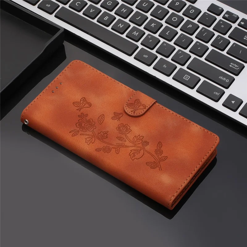 For iPhone 17e / 16e Case Leather Imprinted Flower Phone Cover Wallet with Wrist Strap - Brown