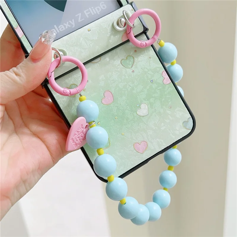 For Samsung Galaxy Z Flip7 FE 5G / Z Flip6 5G Case Anti Drop PC + PU Phone Back Cover with Beaded Strap Pattern Design - Green Heart