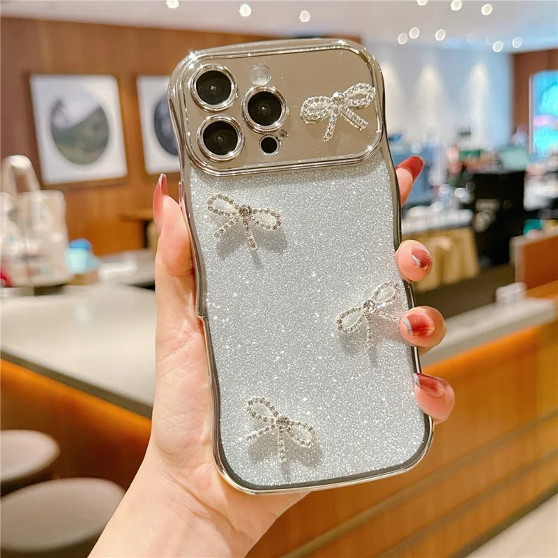 For iPhone 16 Pro Max Case Electroplated Wavy Frame Glitter TPU Phone Cover with Rhinestone Bow Decor - Silver