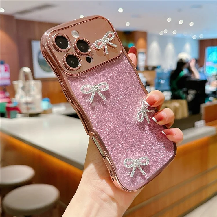 For iPhone 16 Pro Case Electroplated Wavy Frame Glitter TPU Phone Cover with Rhinestone Bow Decor - Rose Pink