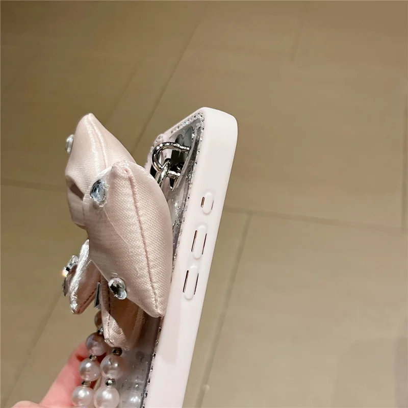 Funda para iPhone 16 con Diseño de Purpurina Epoxi, Carcasa Trasera de TPU + PC con Lazo, Decoración de Strass - Rosa