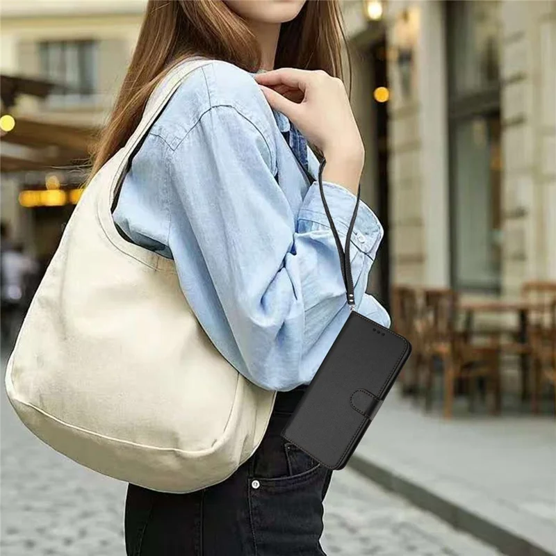Funda de cuero para iPhone 16e con soporte tipo cartera y correa de muñeca - Negro