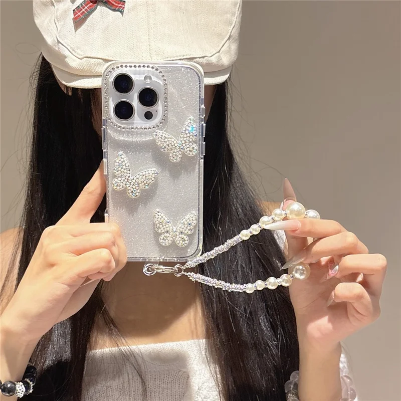 For iPhone 16 Pro Case Glitter Rhinestone Decor Butterfly TPU + PC Phone Case with Beaded Strap - Black