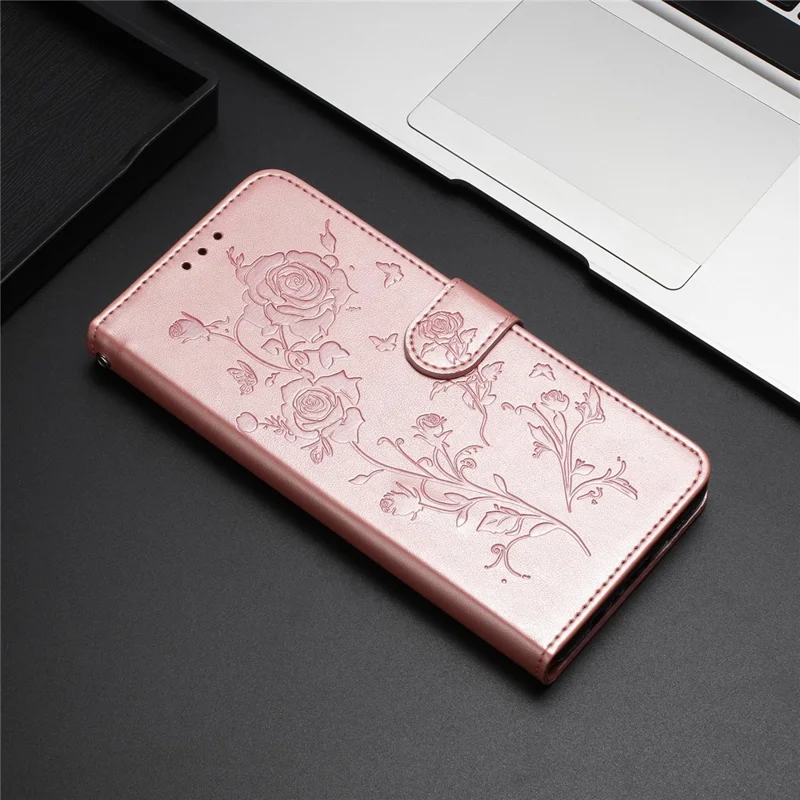 For iPhone 17 Wallet Case Rose Pattern Imprinted Leather Flip Stand Phone Cover with Strap - Rose Gold