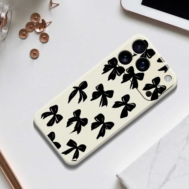 For iPhone 17 Pro Case Black Bow Pattern Printing Straight Edge TPU Phone Back Cover - Beige