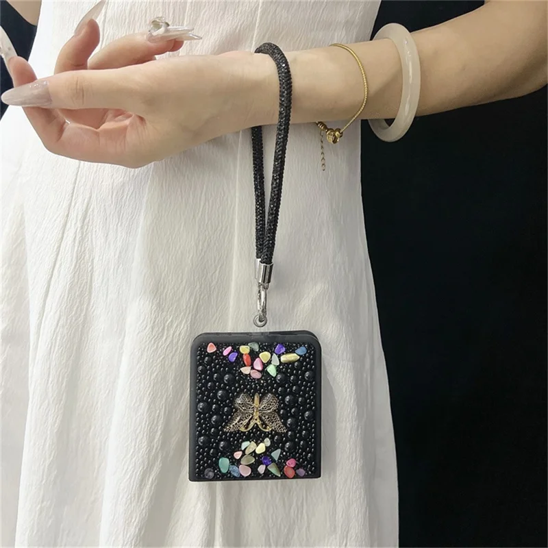 Funda para Samsung Galaxy Z Flip7 5G con Correa de Mano, Decoración de Mariposa con Strass de Colores, Carcasa Protectora de PC - Negro