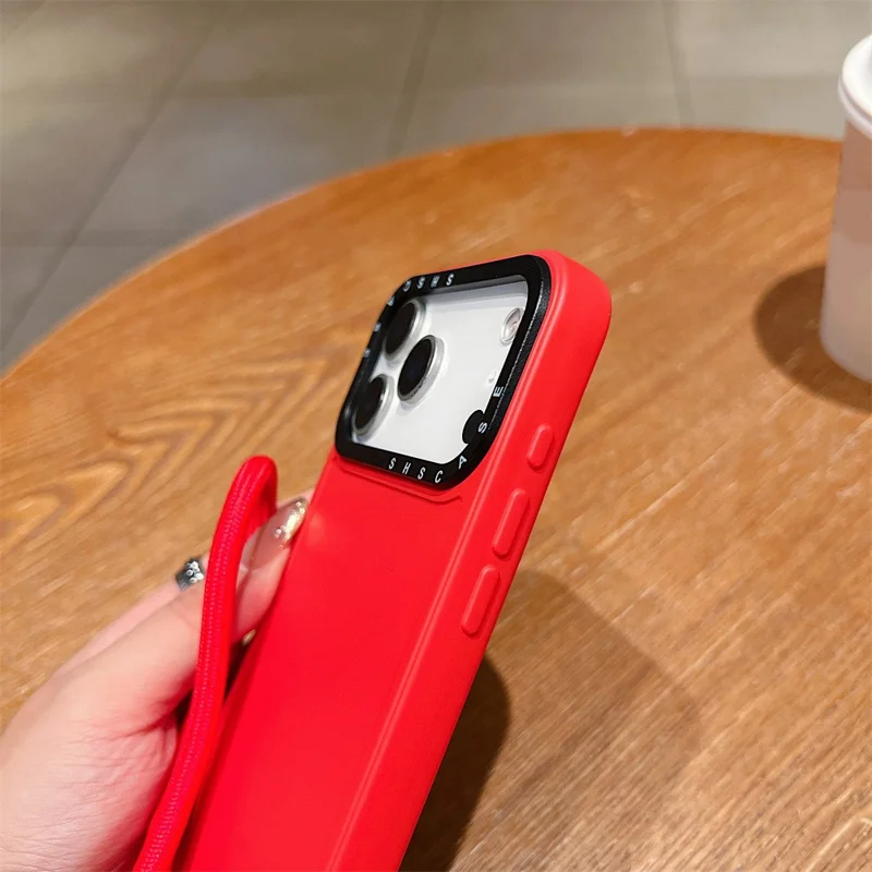 For iPhone 17 Pro Case Black Lens Frame Shockproof TPU PC Phone Back Cover with Wrist Strap - Red