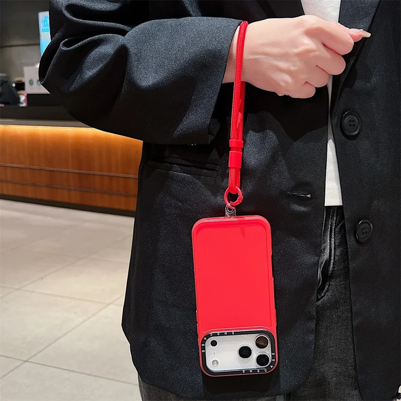 For iPhone 18 Pro Max / 17 Pro Max Case Black Lens Frame Shockproof TPU PC Phone Back Cover with Wrist Strap - Red